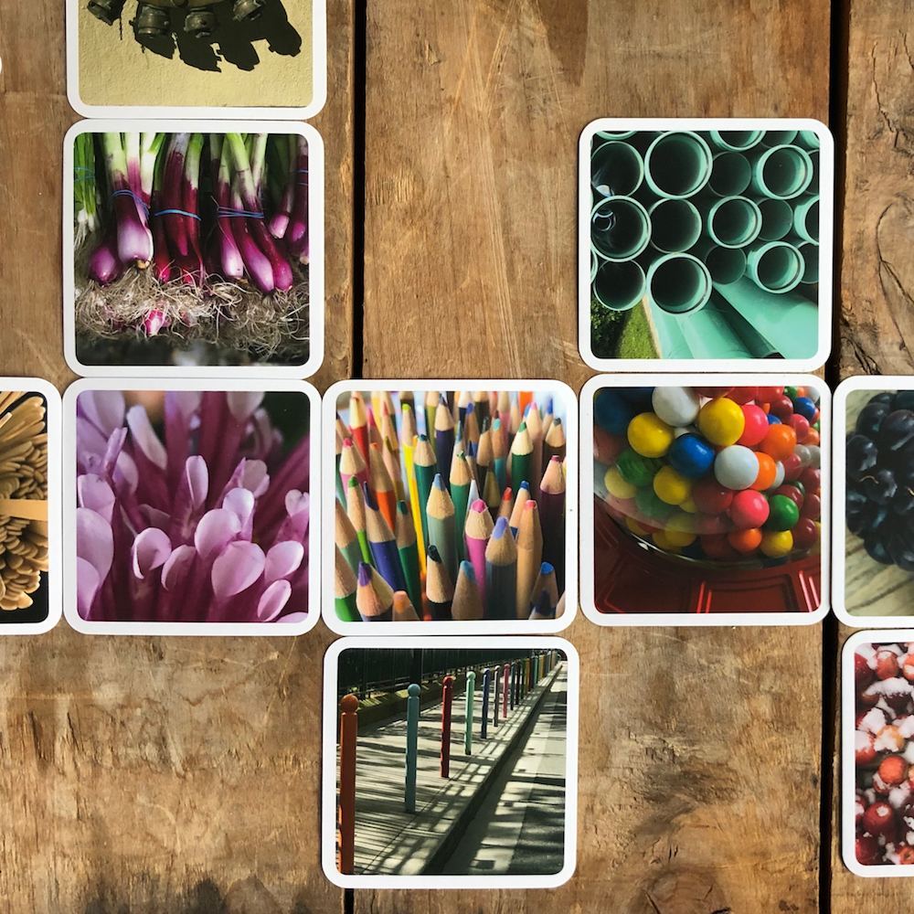 Photo cards spread out like a dominoes board. Each card visually connects with the card next door.